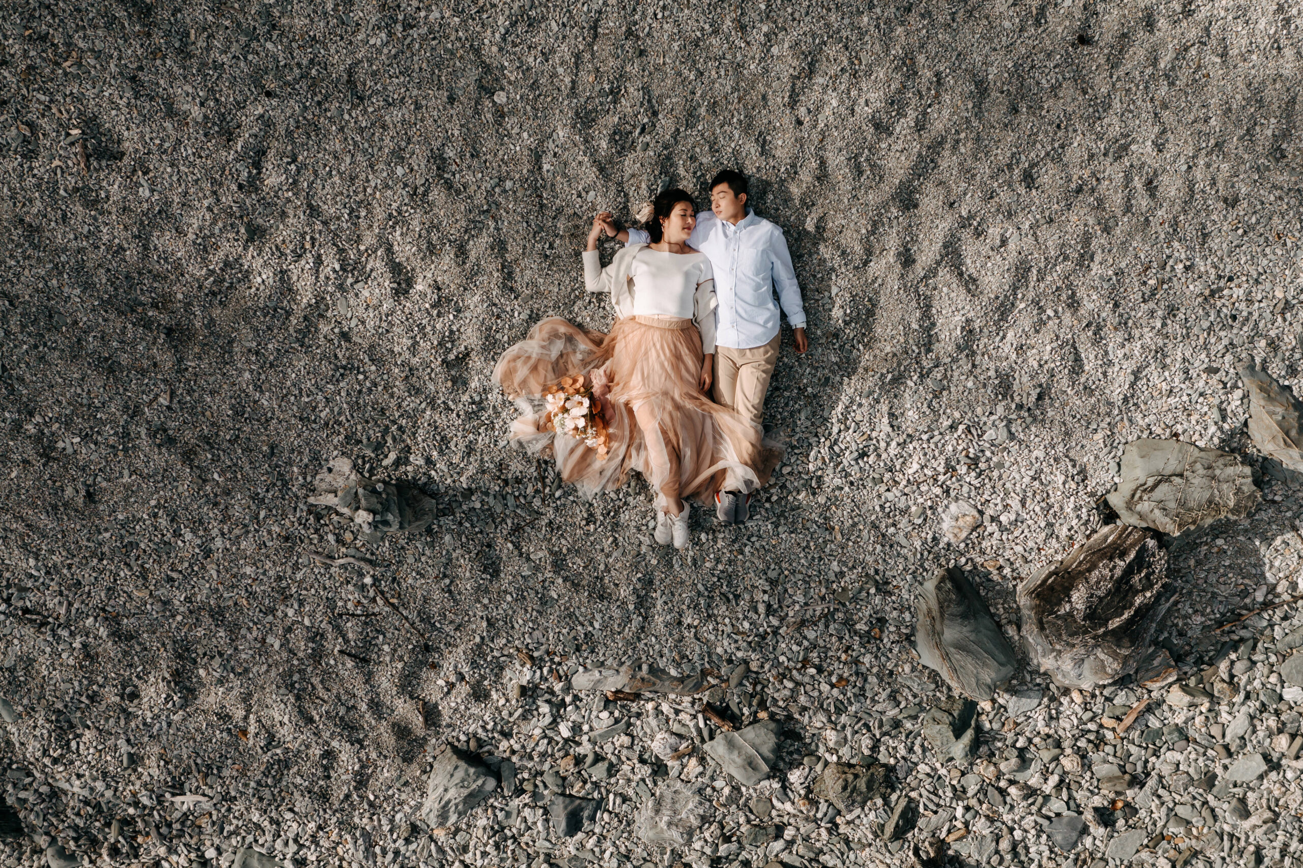 Bride and Groom on the shore of Lake Wakatipu, Queenstown on their elopement day