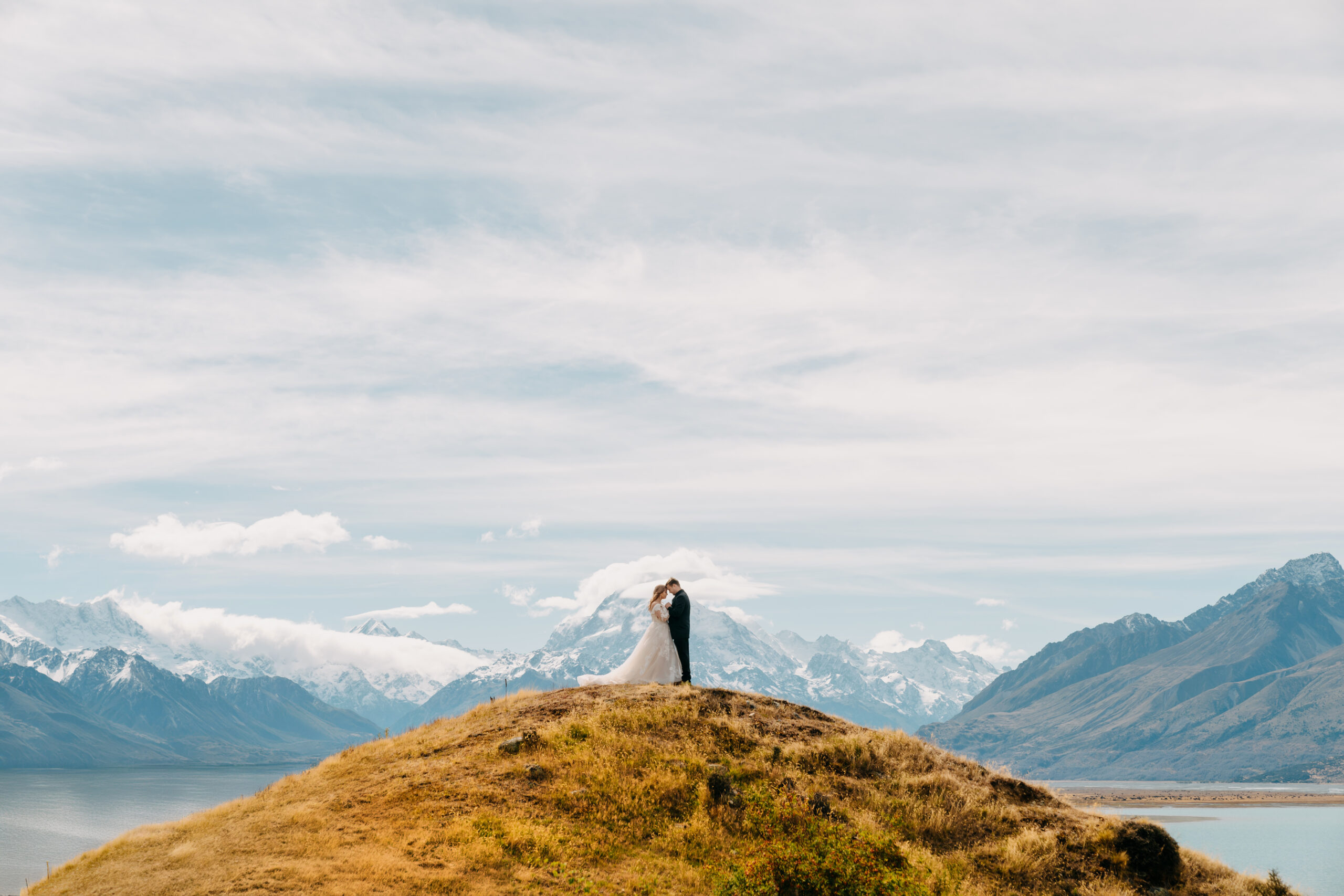 Couple hugging with Mount Cook National Park in the background