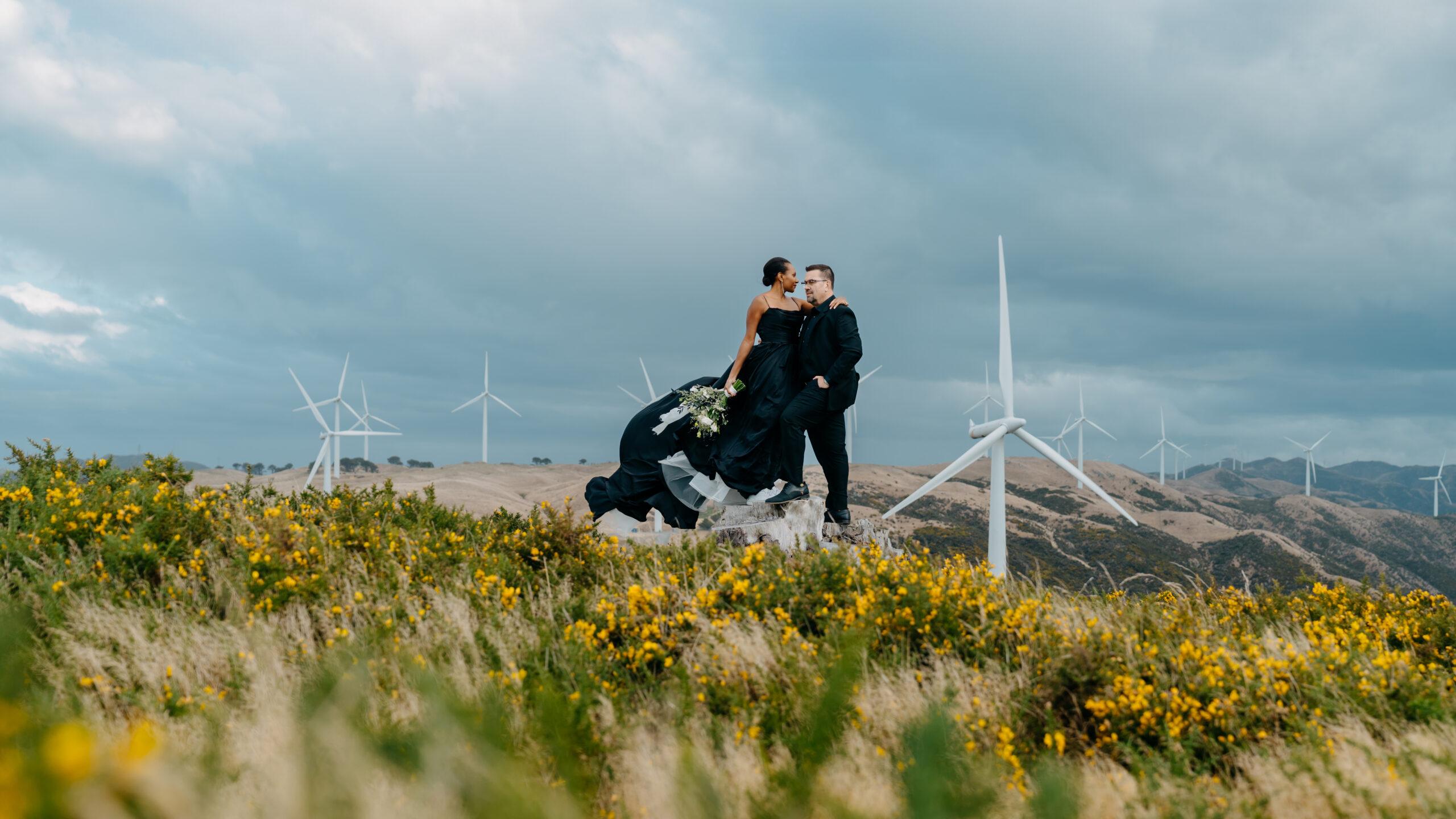Wedding day photoshoot with Wellington Wind Turbines in the backdrop