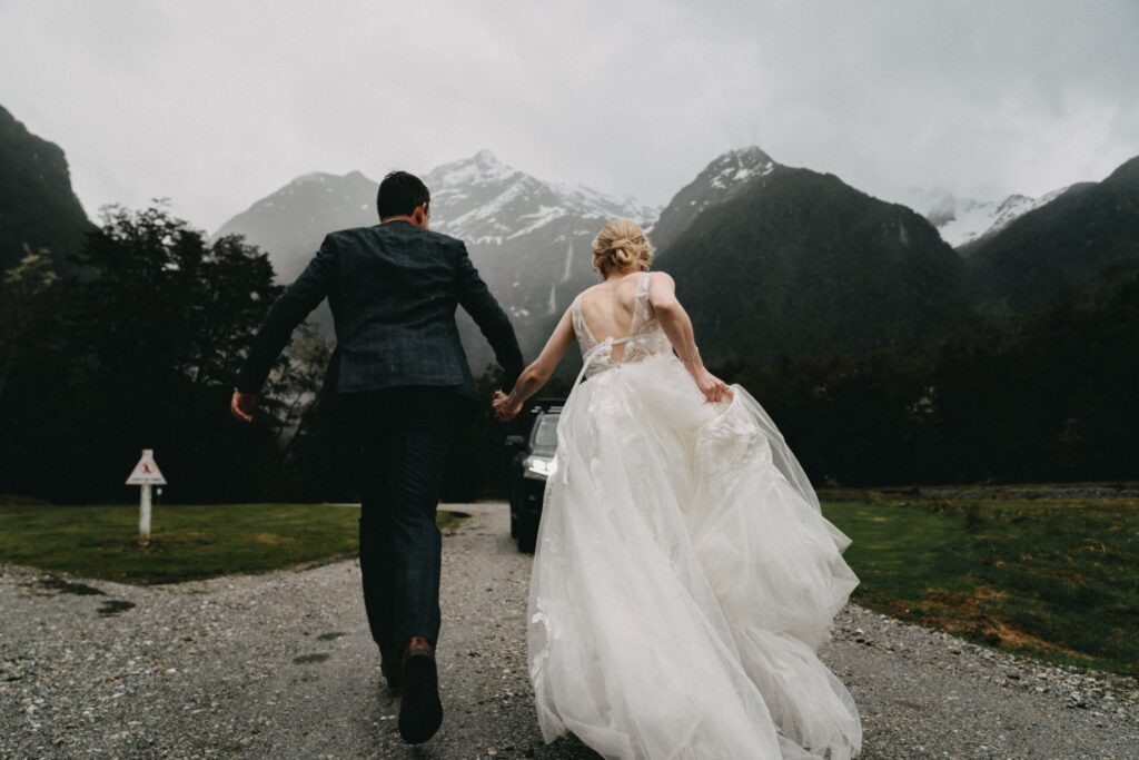 couple running away in an elopement style