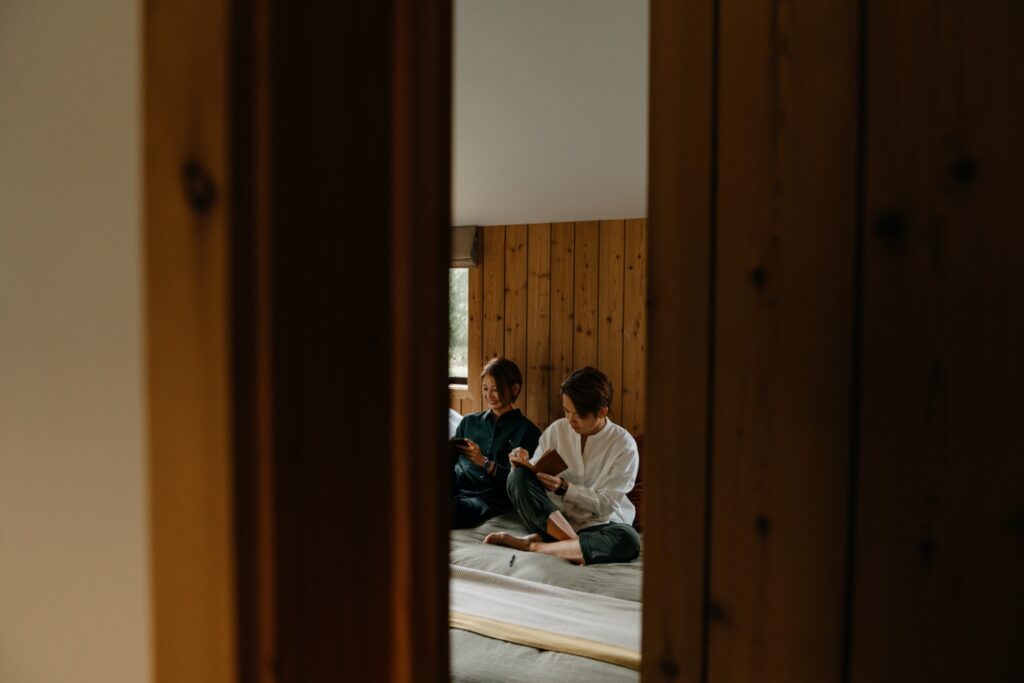 lesbian couple writing vows in airbnb