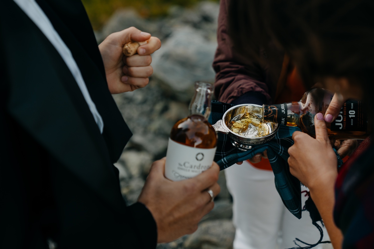 pouring whisky into quaich at mountain New Zealand elopemenet