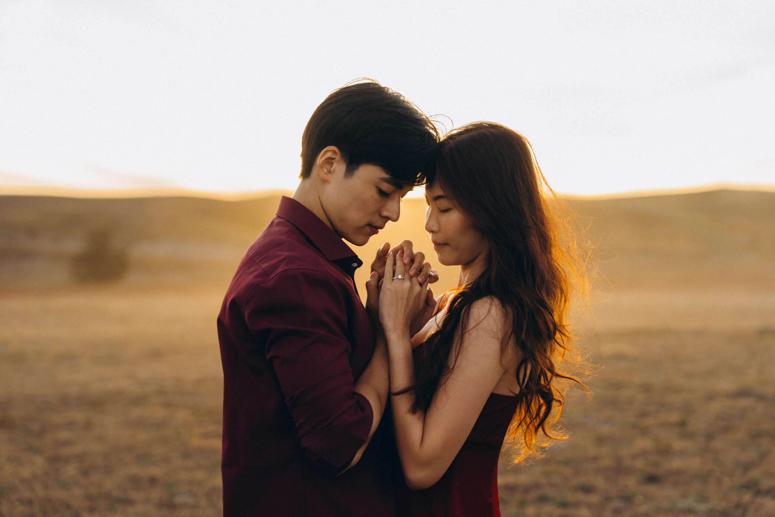 Romantic sunset moment during surprise engagement shoot in Tekapo