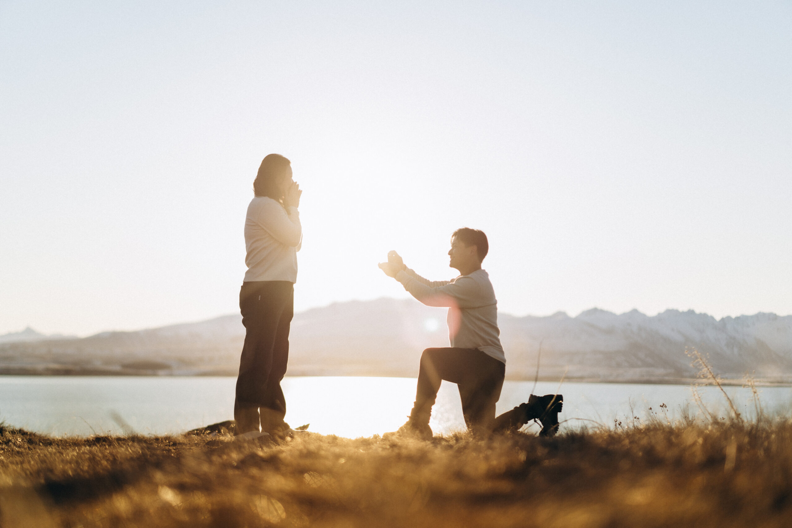 Yu and Shawn Surprise Proposal during sunset at Lake Tekapo