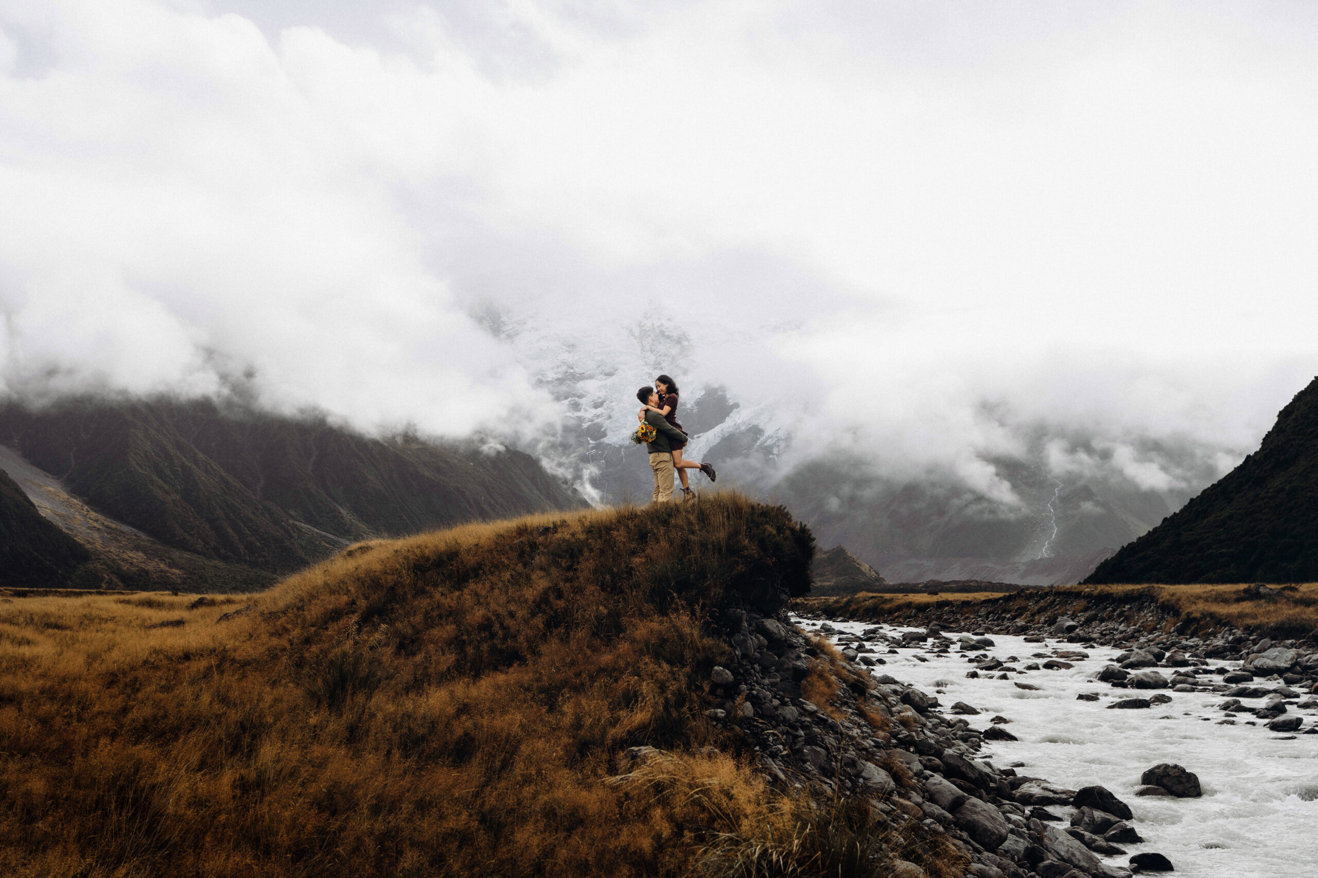 Couple celebrating in the beautiful mount cook national park